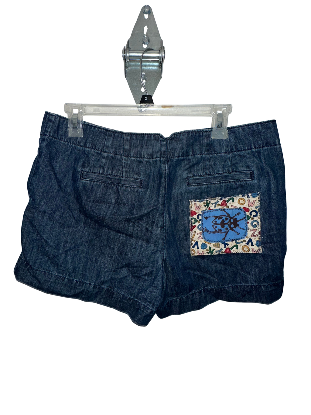 (8) Laced-Up Lady Bug Denim Shorts